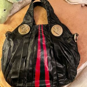 Authentic Gucci bag. This bag has been well loved with stripe hand painted.